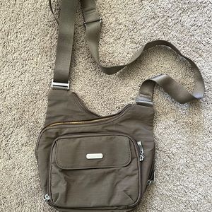 Baggallini crossbody bag. Light brown with yellow interior